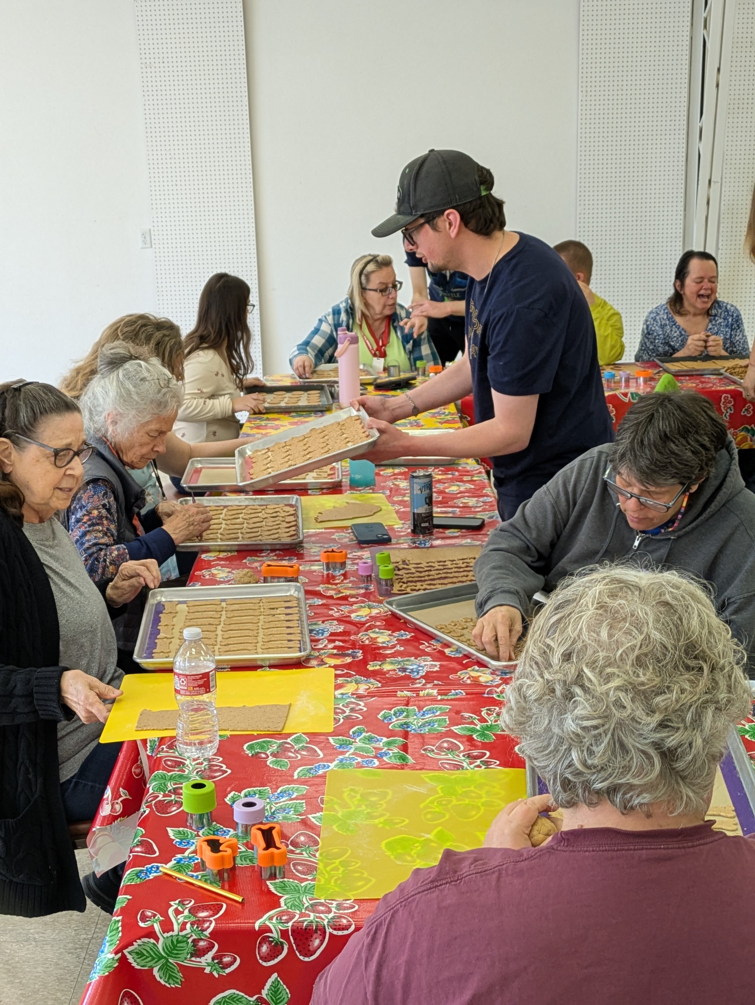   Gatheringplace participants making dog biscuits and friends. Photo by Scott France  