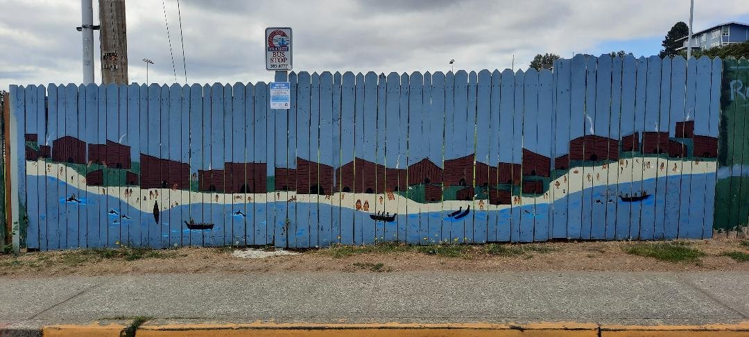   A mural of the original indigenous village occupying the Memorial Field site is depicted by native artist Naiome Krienke. Photo by Kathie Meyer  