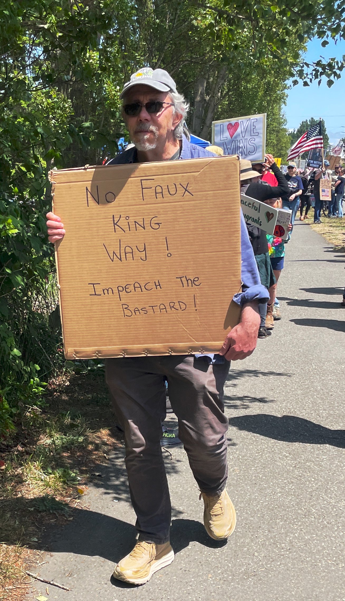   One of many creative signs at the protest. Photo by Angela Downs  