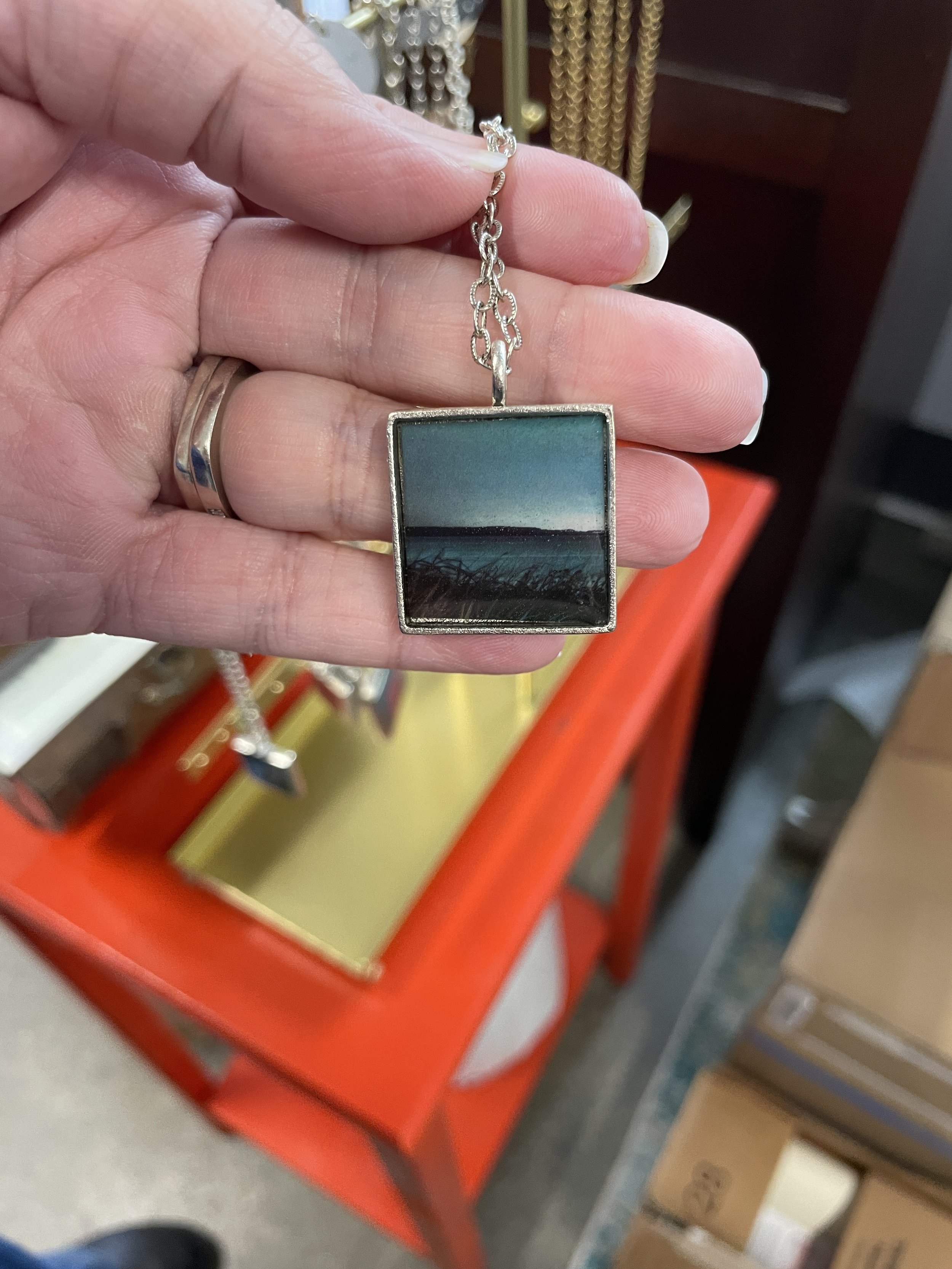   Resin jewelry is by Christee Ballard of Christee Ballard Design. Photo by Angela Downs  