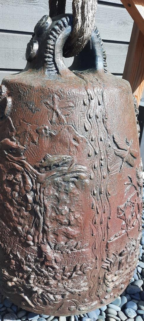 Tom Jay's bell, likely his last work, is covered with Pacific Northwest nature icons.