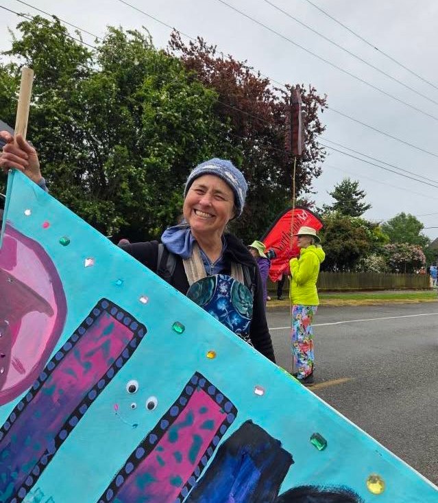   Port Townsend artist Margie McDonald will shepherd an art-mask-making activity at the Northwind Art Gala. She's pictured here in the 2025 Rhody Parade. photo by Meg Kaczyk  