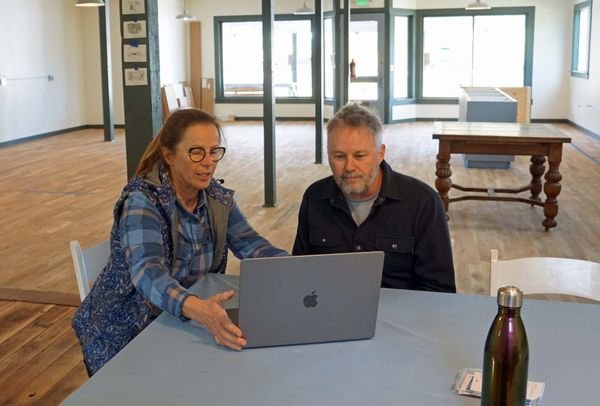 Nordland General Store Board President Patti Buckland, left, plans an opening strategy with General Manager Brian Waldera.