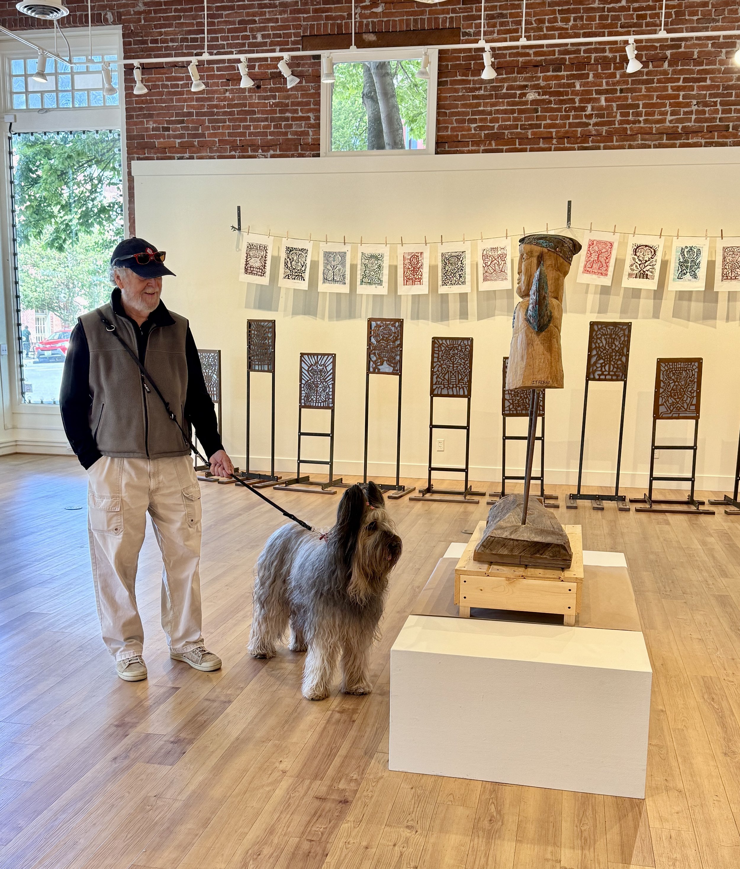   A pair of visitors check out Chuck Iffland's exhibition earlier this year at Northwind Art's Jeanette Best Gallery. photo by Diane Urbani/Northwind Art   