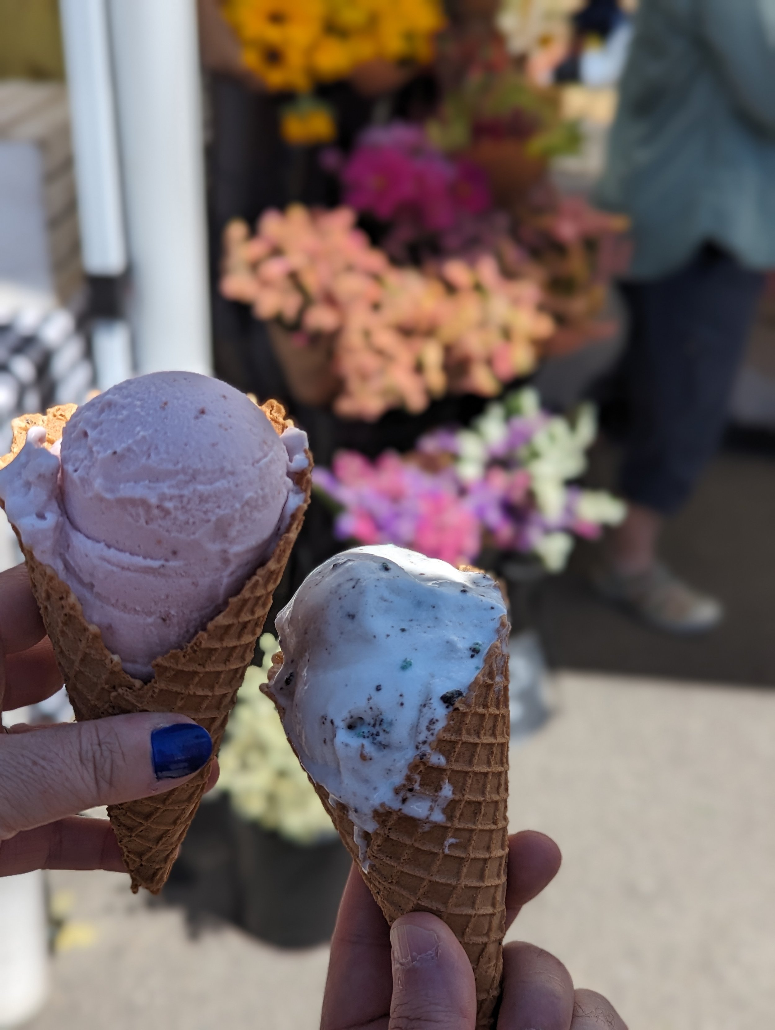 A scoop of strawberry and a scoop of mint cookies and cream at the farmer’s market