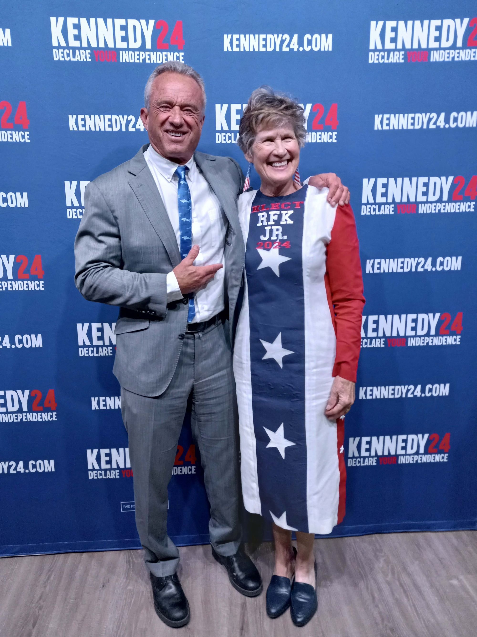   Robert F. Kennedy Jr. poses with supporter Kim Vogley of Quilcene during a campaign stop this spring. Vogley created her dress, to show support for the candidate. (photo courtesy Kim Vogley)  