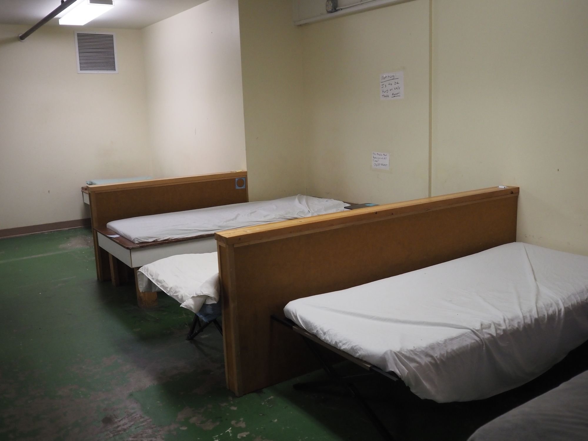   Plenty of cots remain unoccupied at the emergency shelter. There are more than enough people sleeping in tents around Port Townsend to fill the shelter, but many prefer the outdoors to the unventilated space under the American Legion Hall. Beacon photo by Derek Firenze  