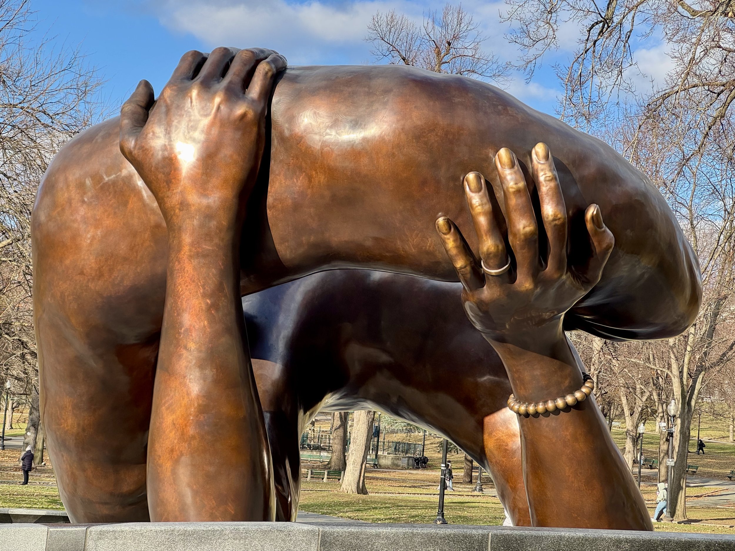  Photo:  Boston Common: Bronze sculpture ‘The Embrace’ by Hank Willis Thomas and MASS Design Group, honouring the life and legacy of Rev. Dr. Martin Luther King, Jr. and Coretta Scott King, based on a photo after Dr King was awarded the Nobel Peace Prize in 1964. Photo by Beena Sarwar.   