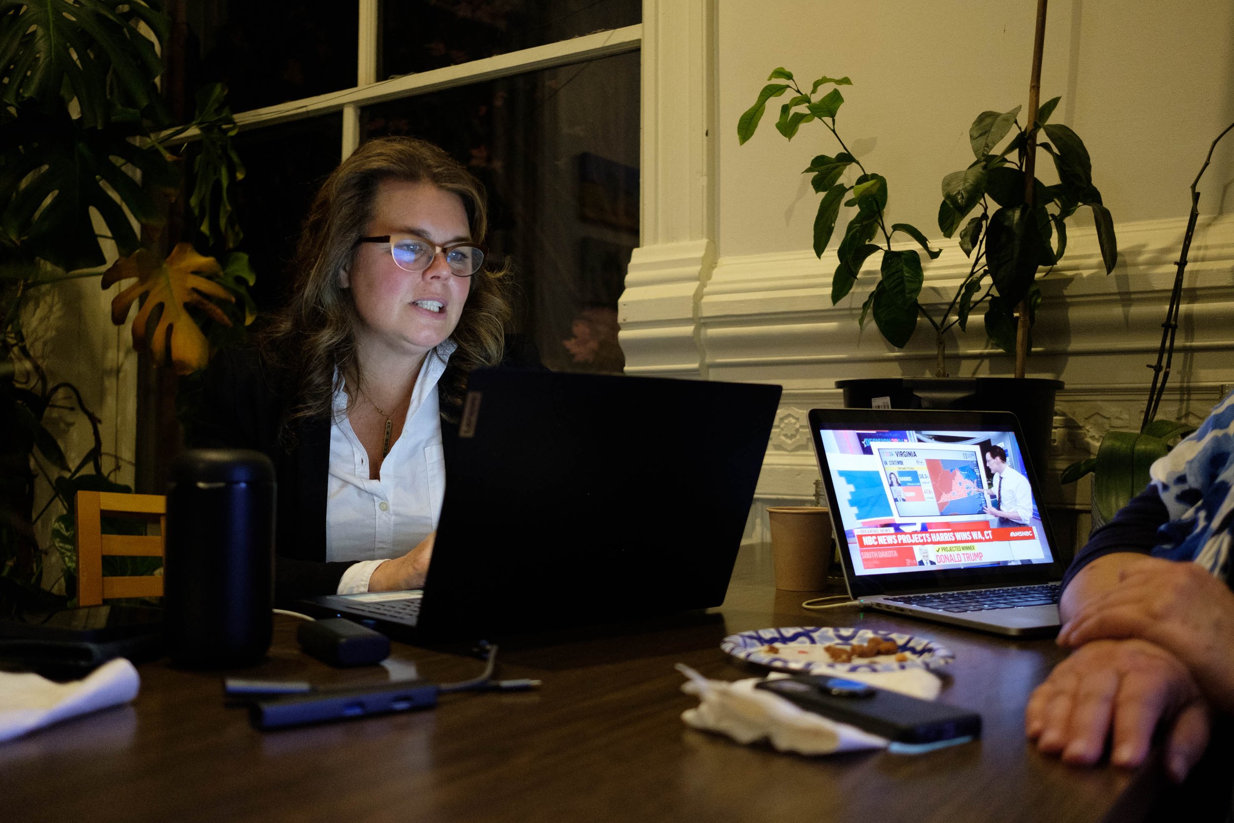  Commissioner Kate Dean watches the election results come in. Photo by Andrew Wiese  