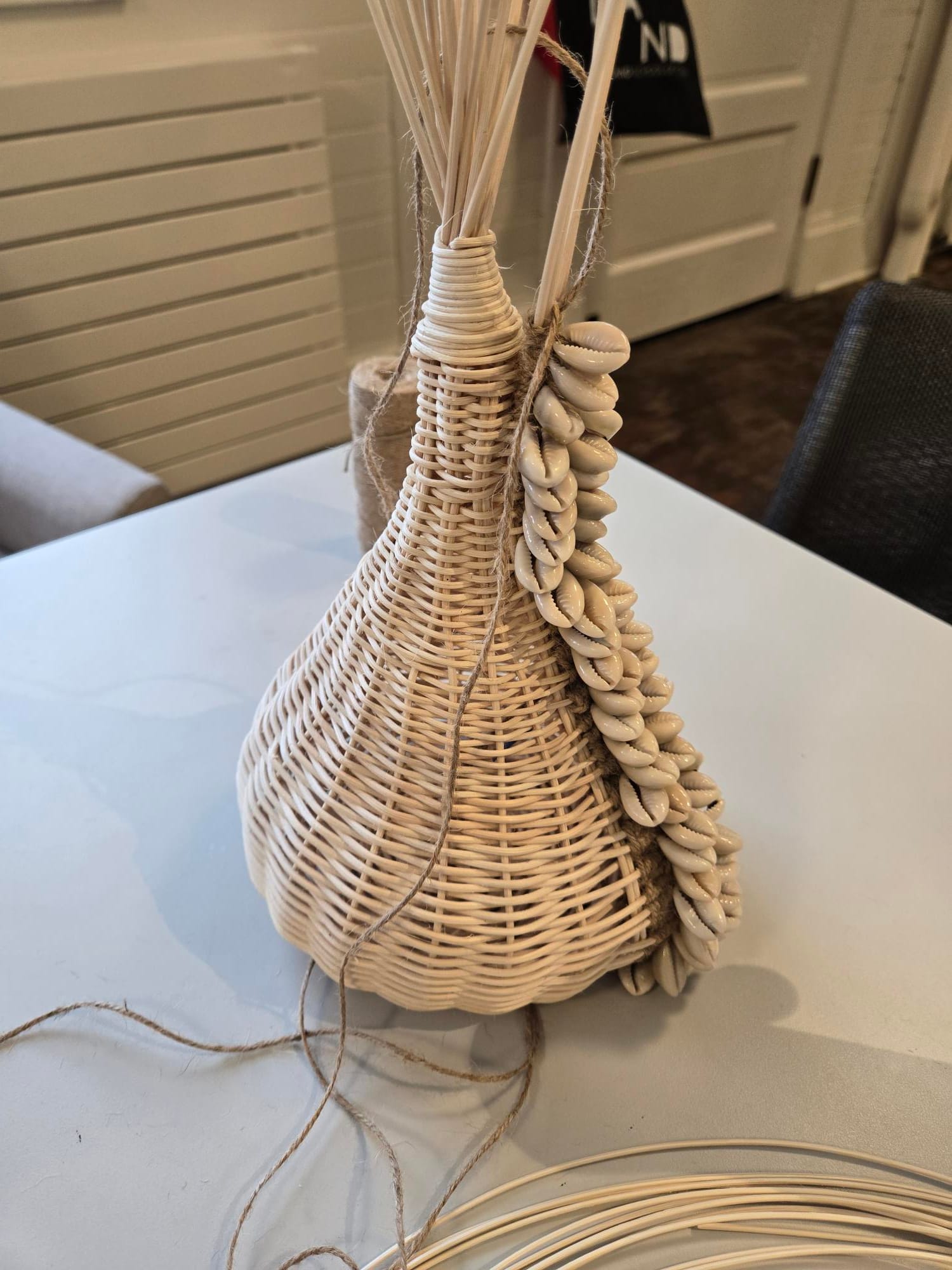  A woven sculpture with shells by ebere agwuncha