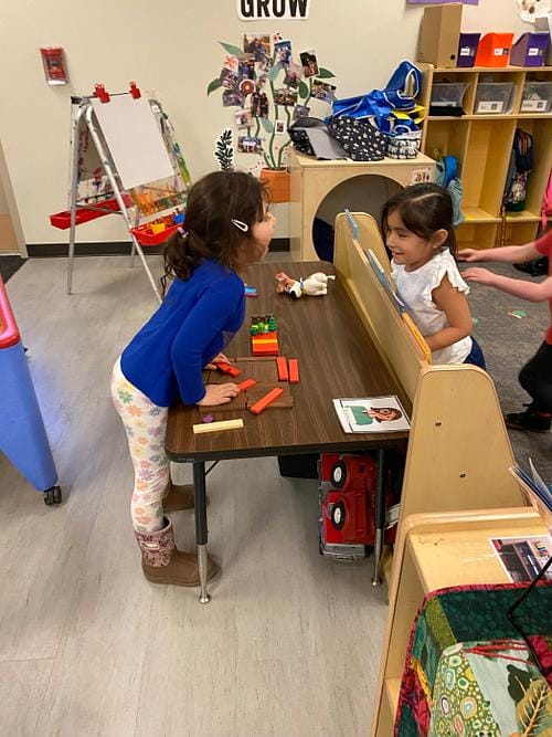 Children engaged in play in a classroom