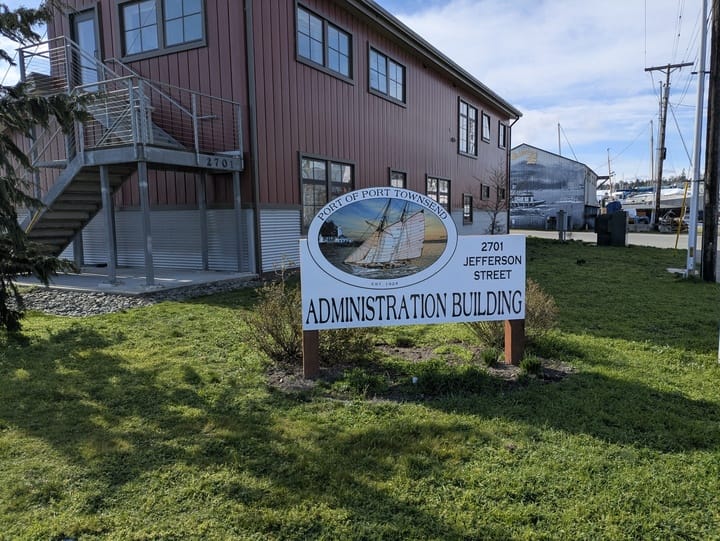 The Port of Port Townsend Administrative Building. A maroon and silver tin building with sign.