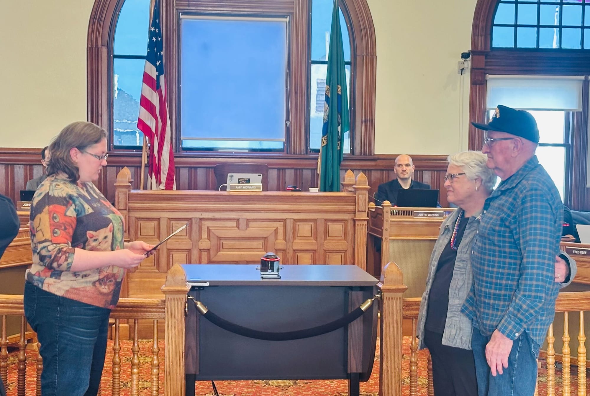 Mayor Amy Howard left, recognizes Medal of Honor recipient Marvin Shields received by his widow Joan Bennett, right
